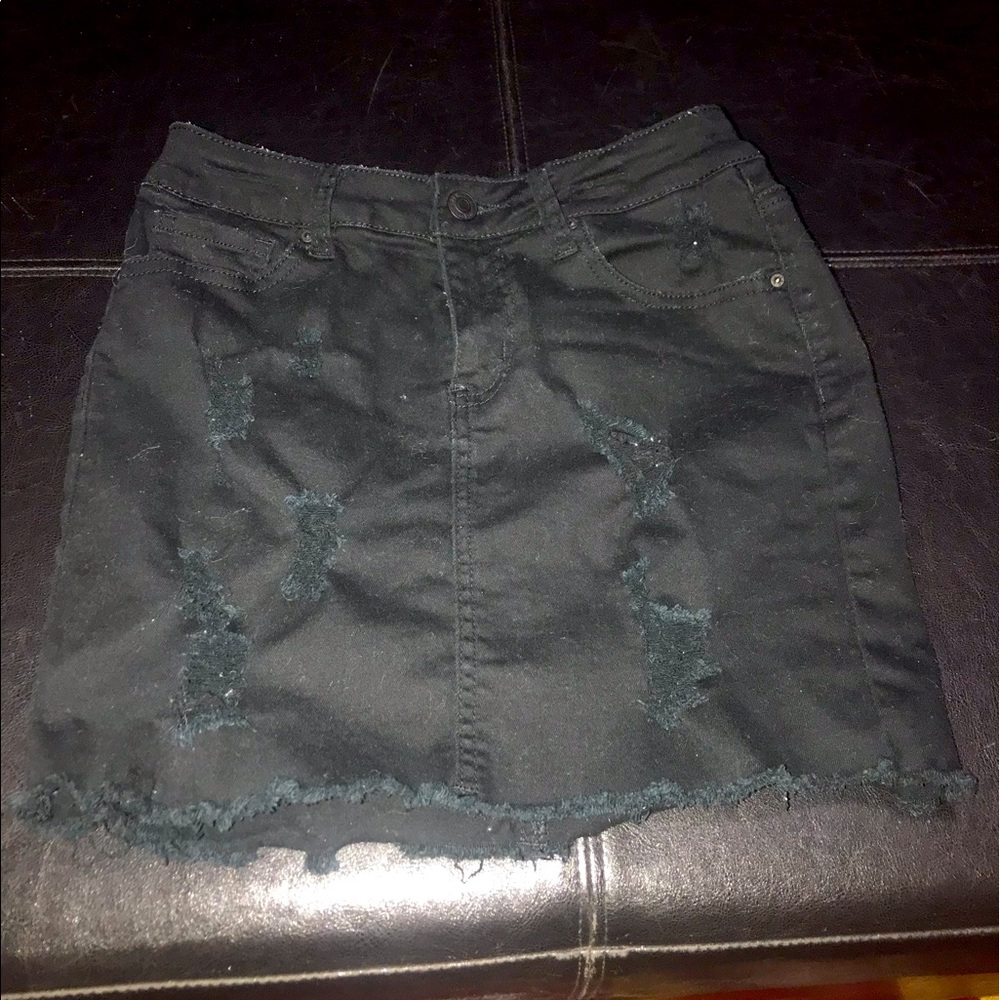 Distressed black denim skirt